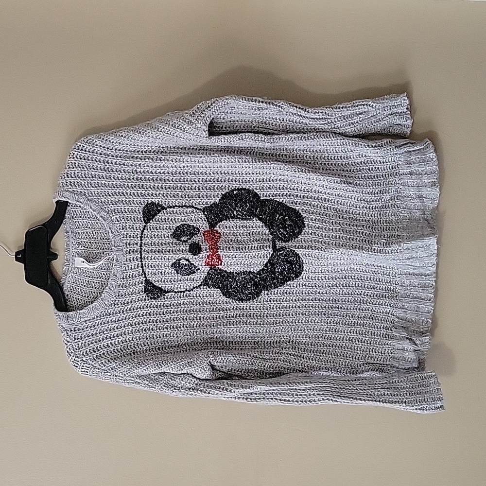 A small light gray Bethany Mota panda sweater